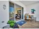 Cozy balcony with tile flooring, patio furniture, and sliding glass doors leading to a living area at 130 Brightwater Dr # 5, Clearwater Beach, FL 33767