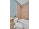 Cozy bathroom featuring a tub and shower combination with tile surround and a white toilet at 130 Brightwater Dr # 5, Clearwater Beach, FL 33767