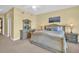 Inviting bedroom with a classic-style bed frame, soft lighting, and serene decor at 130 Brightwater Dr # 5, Clearwater Beach, FL 33767