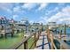 Boat dock featuring multiple boat slips, perfect for boat enthusiasts at 130 Brightwater Dr # 5, Clearwater Beach, FL 33767
