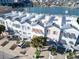 Coastal townhomes featuring private rooftop decks with bay views and covered parking at 130 Brightwater Dr # 5, Clearwater Beach, FL 33767