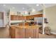 Spacious kitchen with stainless steel appliances and granite countertops for ample cooking and prep space at 130 Brightwater Dr # 5, Clearwater Beach, FL 33767