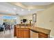 Modern kitchen featuring granite countertops and stainless steel appliances, offering waterfront views and seamless entertaining at 130 Brightwater Dr # 5, Clearwater Beach, FL 33767