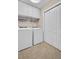 Convenient laundry room with appliances and storage space at 130 Brightwater Dr # 5, Clearwater Beach, FL 33767