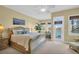 Inviting main bedroom with access to a balcony, creating a bright and airy space at 130 Brightwater Dr # 5, Clearwater Beach, FL 33767