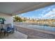 This condo has a covered patio overlooking a pool and the marina waterfront at 130 Brightwater Dr # 5, Clearwater Beach, FL 33767