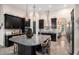 Well-equipped kitchen featuring dark cabinetry, granite countertops, and stainless steel appliances at 13305 Fawn Lily Dr, Riverview, FL 33579