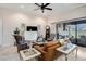 Cozy living room with sliding glass doors that lead to an outdoor patio space at 13305 Fawn Lily Dr, Riverview, FL 33579