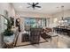 Comfortable living room with sliding glass doors that lead to a large outdoor space at 13305 Fawn Lily Dr, Riverview, FL 33579