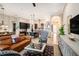 Spacious living room featuring a leather couch, area rug, and neutral colored walls at 13305 Fawn Lily Dr, Riverview, FL 33579