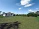 Backyard with a newly seeded lawn at 134 Jade St, Rotonda West, FL 33947
