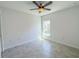 Bedroom with tiled floors and a large window at 134 Jade St, Rotonda West, FL 33947