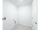 Bright laundry room with white walls, tile floor, and utility connections at 134 Jade St, Rotonda West, FL 33947