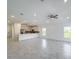 Spacious open-concept kitchen and living area with recessed lighting and modern appliances at 134 Jade St, Rotonda West, FL 33947