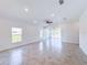 Spacious living room with tile flooring, vaulted ceilings, recessed lighting and lots of natural light at 134 Jade St, Rotonda West, FL 33947
