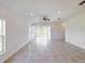 Bright living room features tile floors, recessed lighting, a ceiling fan and lots of natural light at 134 Jade St, Rotonda West, FL 33947