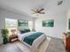 Comfortable main bedroom featuring neutral decor, ample natural light, and modern ceiling fan at 134 Jade St, Rotonda West, FL 33947
