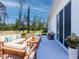 Inviting outdoor patio with comfortable seating, perfect for relaxing and enjoying the serene backyard view at 134 Jade St, Rotonda West, FL 33947