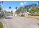 Gated entrance to a residential community with landscaping at 1524 Lago Vista Blvd, Palm Harbor, FL 34685