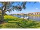 Scenic waterfront view of boat docks by the lake and a residential community at 1524 Lago Vista Blvd, Palm Harbor, FL 34685