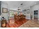 Dining room with hardwood floors, a window with a view and a ceiling fan at 1550 Chukar Rdg, Palm Harbor, FL 34683