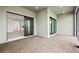Lanai with brick-style flooring offering access to the main house through sliding glass doors at 17069 Moonflower Dr, Venice, FL 34293