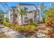 Attractive two-story townhouse with well-maintained landscaping, adding to its curb appeal at 1735 Lake Cypress Dr, Safety Harbor, FL 34695