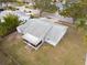 Aerial shot of home featuring spacious backyard, enclosed patio and mature trees at 1875 Seton Dr, Clearwater, FL 33763