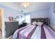 Bedroom featuring light blue walls, light wood floors, and a full sized bed at 1875 Seton Dr, Clearwater, FL 33763