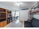 Bedroom featuring a ceiling fan, models on display, a closet, and a gray futon at 1875 Seton Dr, Clearwater, FL 33763