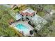 Stunning aerial view of the home, showcasing the pool, jacuzzi, patio, and meticulously maintained yard at 215 Willowick Ave, Temple Terrace, FL 33617