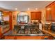 Bright, updated kitchen featuring granite countertops, stainless steel appliances, and custom wood cabinetry at 215 Willowick Ave, Temple Terrace, FL 33617