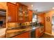 Updated kitchen with stainless appliances, granite countertops, and custom wood cabinetry with wine rack at 215 Willowick Ave, Temple Terrace, FL 33617