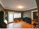 Comfortable music room with hardwood floors, featuring a piano and two guitars near a door at 215 Willowick Ave, Temple Terrace, FL 33617