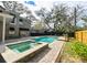 Backyard oasis featuring a swimming pool, in-ground hot tub, and mature landscaping at 215 Willowick Ave, Temple Terrace, FL 33617