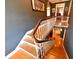 Elegant staircase with hardwood steps, white railings, and stylish decor, connecting multiple levels at 215 Willowick Ave, Temple Terrace, FL 33617