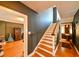 Beautiful staircase with hardwood steps, connecting different levels of the home, next to the music room at 215 Willowick Ave, Temple Terrace, FL 33617