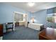 Bedroom with blue walls, carpet and a connected desk and workspace at 2405 S Ardson Pl # 303A, Tampa, FL 33629