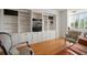 Living room featuring custom built-in shelves and a media center at 2405 S Ardson Pl # 303A, Tampa, FL 33629