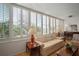 Bright living room with large windows and plantation shutters, offering plenty of sunlight at 2405 S Ardson Pl # 303A, Tampa, FL 33629