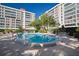 Condo complex offers a cozy community pool with outdoor seating and lush surroundings at 2405 S Ardson Pl # 303A, Tampa, FL 33629