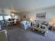Inviting living room with comfortable seating, dining area and lots of light at 2431 Franciscan Dr # 45, Clearwater, FL 33763