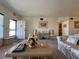 Cozy living room featuring a floral sofa and an inviting entrance at 2431 Franciscan Dr # 45, Clearwater, FL 33763