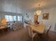 Inviting living room featuring floral-patterned furniture and a dining area at 2431 Franciscan Dr # 45, Clearwater, FL 33763