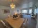 Comfortable living room with chandelier, light, dining area and view of the entrance at 2431 Franciscan Dr # 45, Clearwater, FL 33763