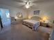 Relaxing main bedroom featuring a comfortable bed and ample lighting at 2431 Franciscan Dr # 45, Clearwater, FL 33763