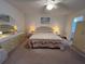 Spacious main bedroom with soft lighting and comfortable furniture at 2431 Franciscan Dr # 45, Clearwater, FL 33763