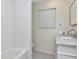 Bathroom featuring tiled shower and marble vanity at 2514 W Morrison Ave, Tampa, FL 33629