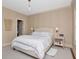 Cozy bedroom featuring neutral tones, carpet floors, a ceiling light, and two side tables at 2514 W Morrison Ave, Tampa, FL 33629