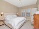 Bright bedroom featuring a large window, creating a cozy atmosphere with plenty of natural light at 2514 W Morrison Ave, Tampa, FL 33629